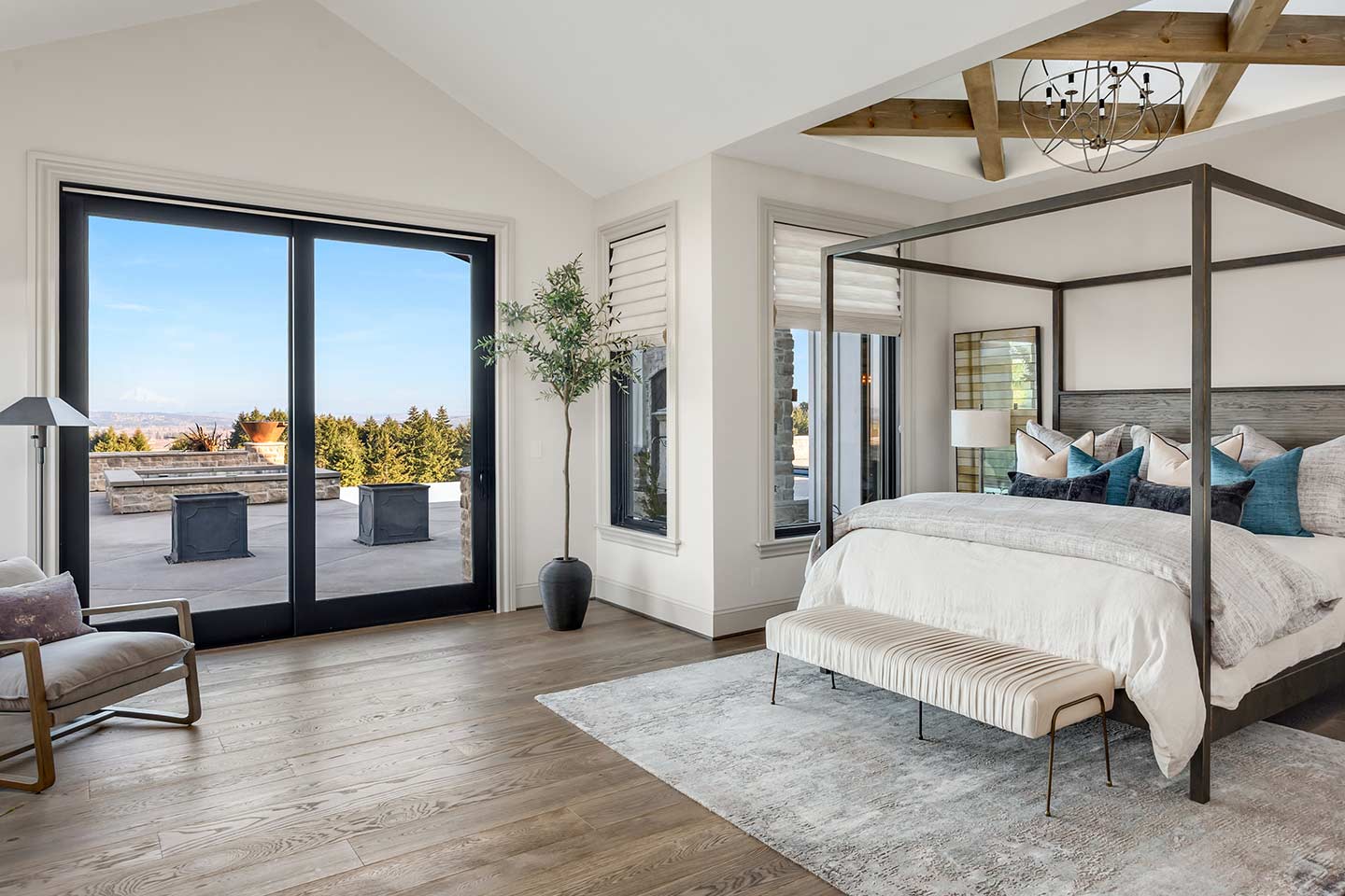 gorgeous French door flanked by two sidelites and an arched transom providing an expansive view to a beautiful garden